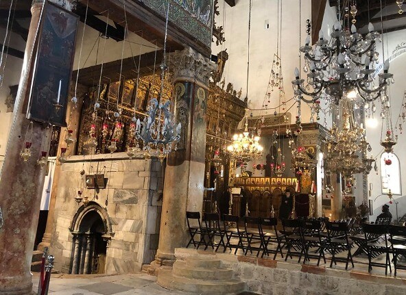 the ornate interior of the Church of the Nativity in Bethlehem the ornate interior of the Church of the Nativity in Bethlehem