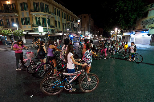 israel holidays - yom kippur kids bike on tel aviv streets day and night 