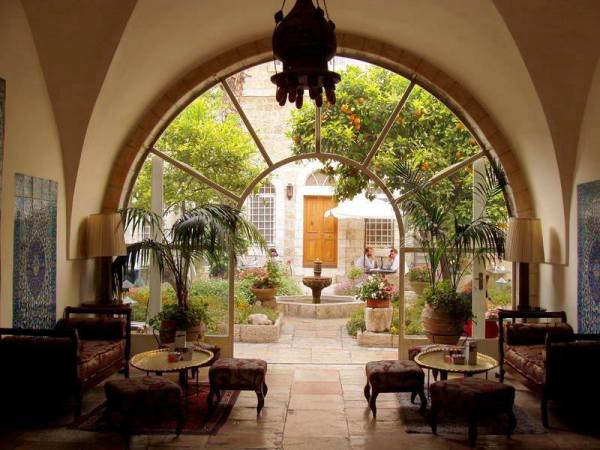 The American Colony hotel in East Jerusalem boasts antique furniture and combines Middle Eastern and Colonial-style decor The American Colony hotel in East Jerusalem boasts antique furniture and combines Middle Eastern and Colonial-style decor