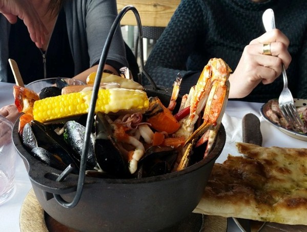 Manta Ray restaurant in Tel Aviv on the sea serves mixed seafood in a cast iron pot