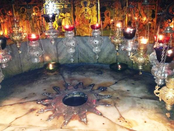 fourteen point star in the Grott in the Church of the Nativity in Bethlehem marks the exact place where Jesus was born fourteen point star in the Grott in the Church of the Nativity in Bethlehem marks the exact place where Jesus was born