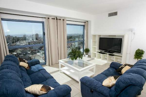 Windows of Jerusalem Hotel living room with great views of the city Windows of Jerusalem Hotel living room with great views of the city