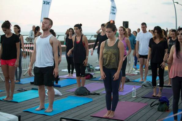 Friday morning yoga class for free at the Tel Aviv Port